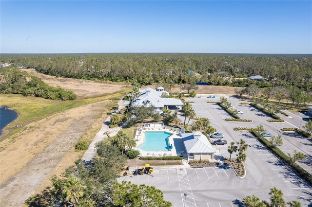 2388 Silver Palm Rd, North Port, FL 34288 - drone / aerial view of a pool area and a heavily wooded area