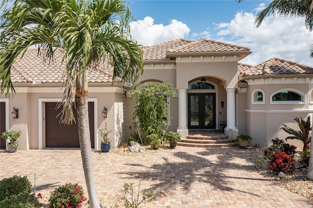 mediterranean / spanish-style home featuring french doors