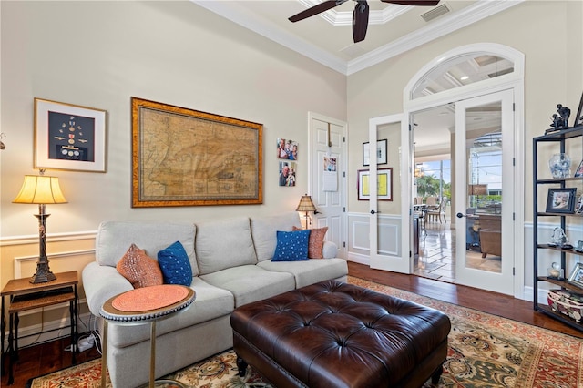 living room with ceiling fan, crown molding, and dark hardwood / wood-style flooring