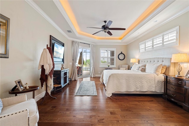 bedroom featuring access to exterior, dark hardwood / wood-style floors, ceiling fan, and crown molding