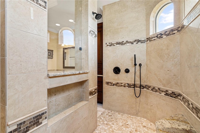 bathroom with tiled shower