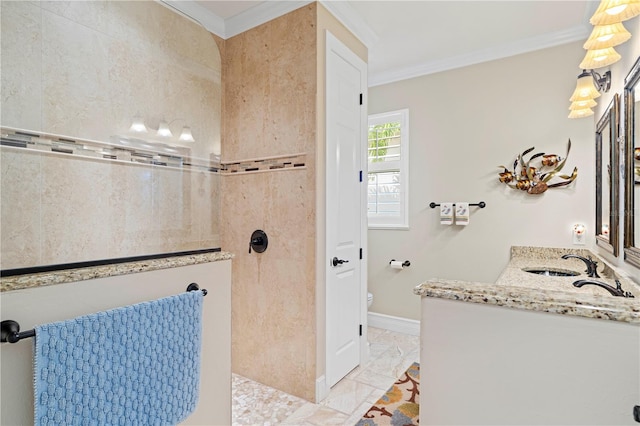 bathroom featuring vanity, ornamental molding, and tiled shower