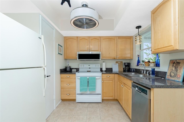 kitchen with pendant lighting, light brown cabinets, sink, and stainless steel appliances