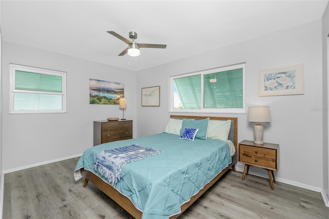 bedroom featuring ceiling fan and light hardwood / wood-style floors