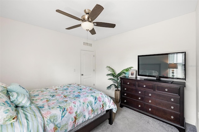 bedroom with ceiling fan and light colored carpet