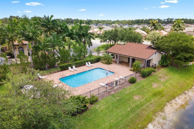 view of pool featuring a lawn and a patio area