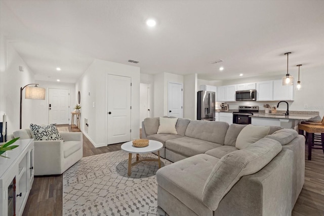 living room featuring dark wood-type flooring