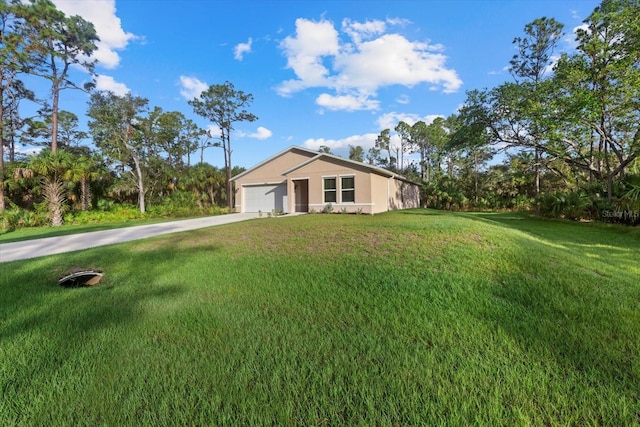 view of front facade featuring a garage and a front lawn