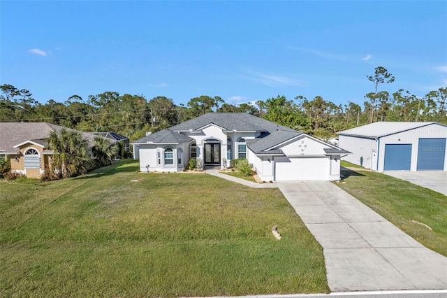 view of front of house featuring a front yard, a garage, and a shingled roof