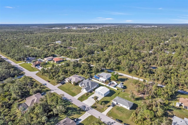 aerial view with a residential view and a wooded view