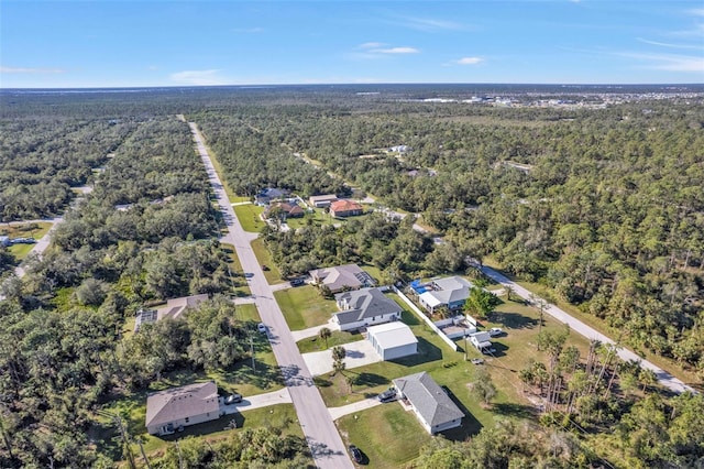 aerial view featuring a wooded view