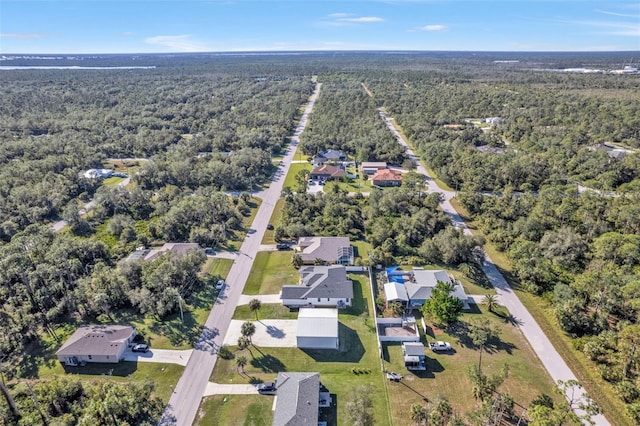 bird's eye view featuring a wooded view