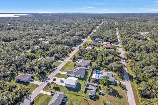 bird's eye view featuring a forest view