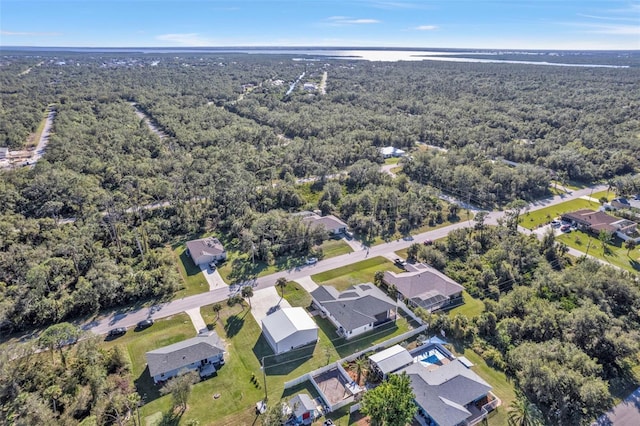 bird's eye view featuring a residential view and a view of trees