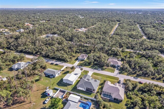 bird's eye view featuring a forest view and a residential view