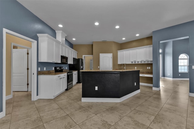 kitchen featuring recessed lighting, white cabinets, stone countertops, and black appliances