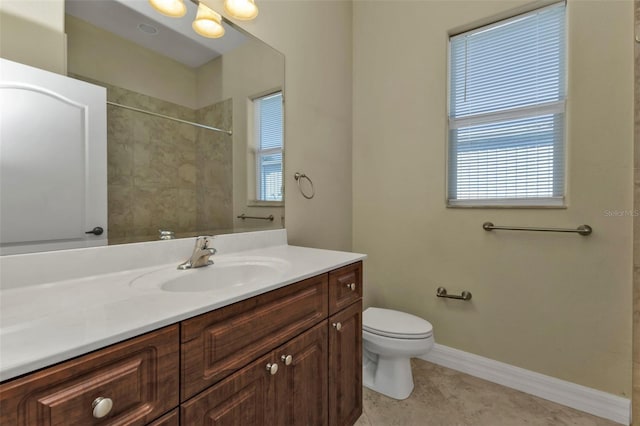 bathroom with vanity, tile patterned floors, and toilet