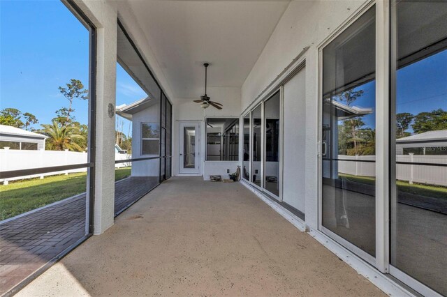 sunroom / solarium with ceiling fan