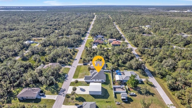 drone / aerial view featuring a view of trees