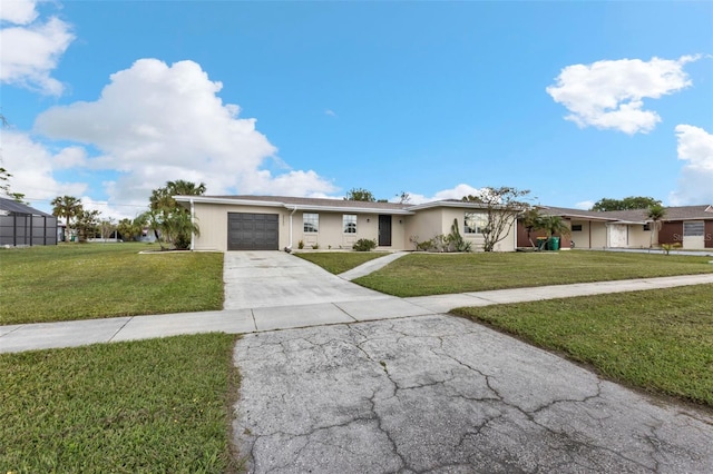 single story home featuring a garage and a front lawn