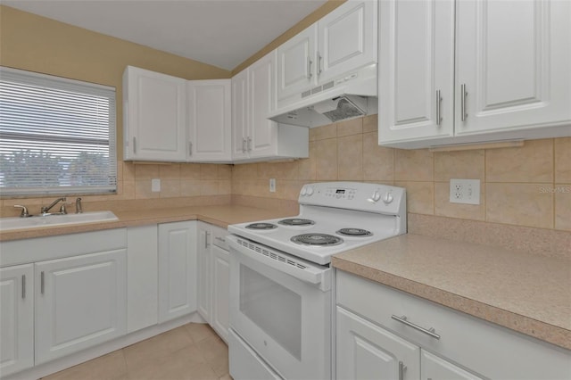 kitchen with white cabinets, white electric range, sink, and light tile patterned floors