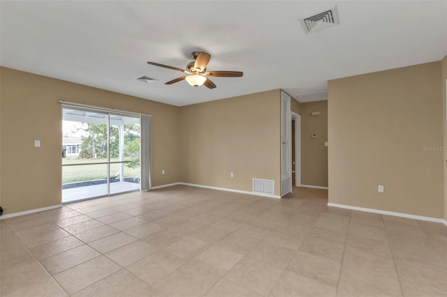 tiled empty room with ceiling fan