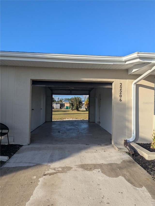 garage featuring a carport