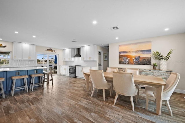 dining area with dark hardwood / wood-style flooring