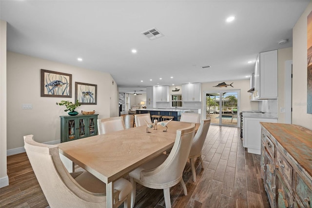 dining area featuring dark hardwood / wood-style flooring