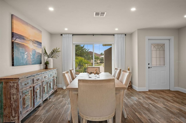 dining space featuring dark wood-type flooring