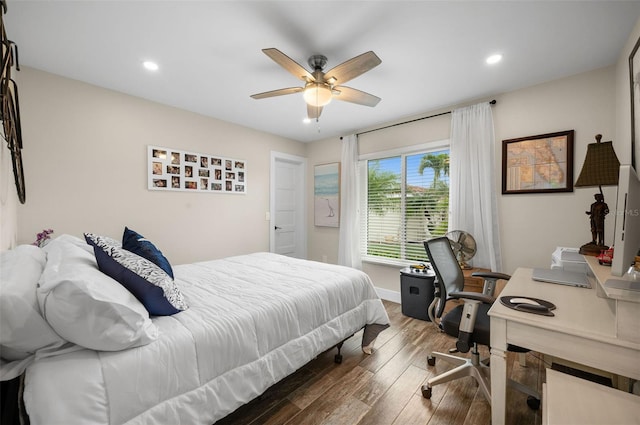 bedroom with dark wood-type flooring and ceiling fan