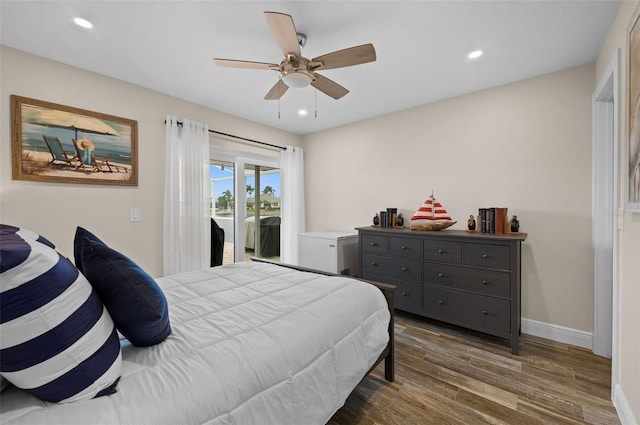 bedroom with ceiling fan, dark hardwood / wood-style flooring, and access to outside