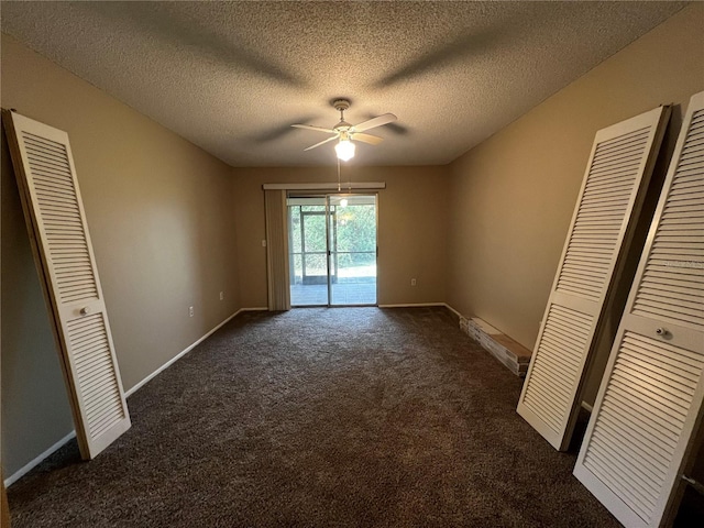 unfurnished bedroom with ceiling fan, dark colored carpet, access to exterior, and a textured ceiling