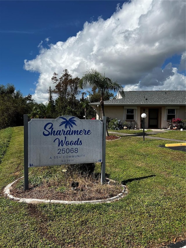 25068 Harborview Rd Unit 1A, Punta Gorda, FL 33980 - community sign with a yard
