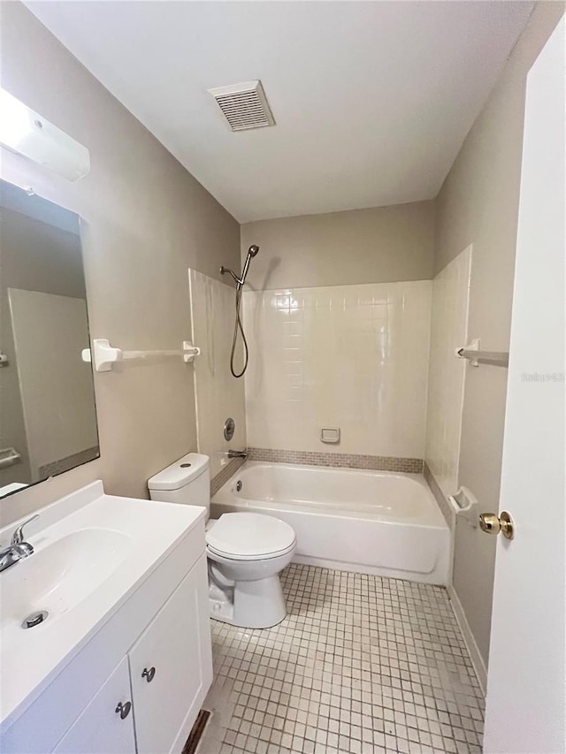 25068 Harborview Rd Unit 1A, Punta Gorda, FL 33980 - bathroom with toilet, vanity, tub / shower combination, and tile patterned floors