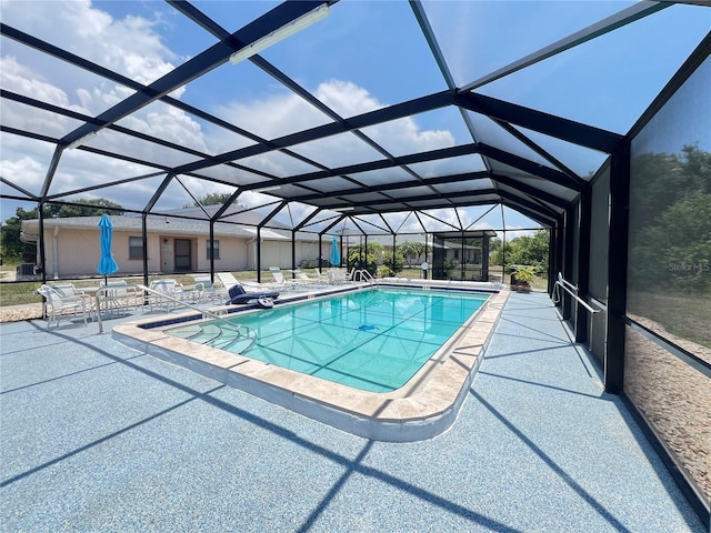 25068 Harborview Rd Unit 1A, Punta Gorda, FL 33980 - swimming pool featuring a patio area and glass enclosure