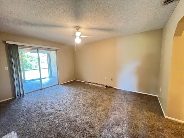 25068 Harborview Rd Unit 1A, Punta Gorda, FL 33980 - carpeted empty room with a ceiling fan, a textured ceiling, and baseboards