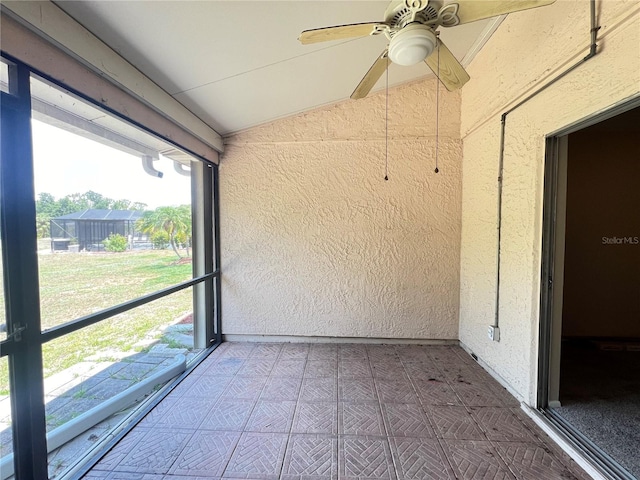 25068 Harborview Rd Unit 1A, Punta Gorda, FL 33980 - unfurnished sunroom with lofted ceiling, a ceiling fan, and healthy amount of natural light