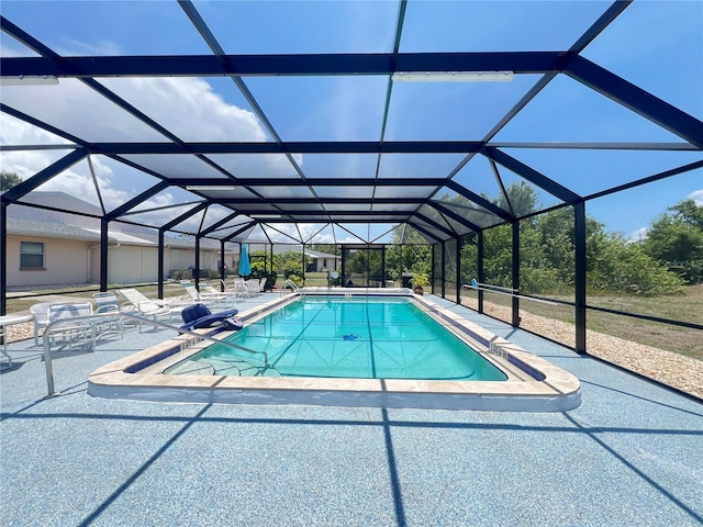 25068 Harborview Rd Unit 1A, Punta Gorda, FL 33980 - swimming pool with a patio and glass enclosure