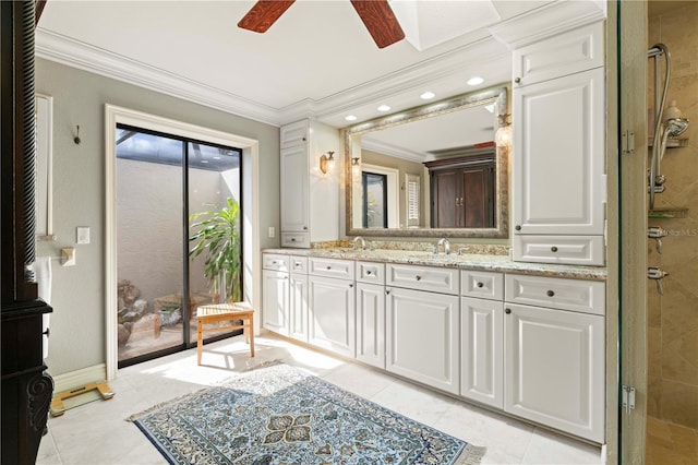 bathroom with tile patterned floors, crown molding, vanity, a shower with door, and ceiling fan