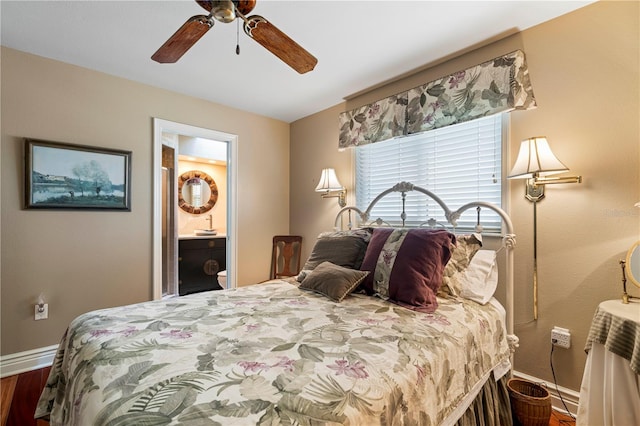 bedroom featuring connected bathroom, ceiling fan, and wood-type flooring