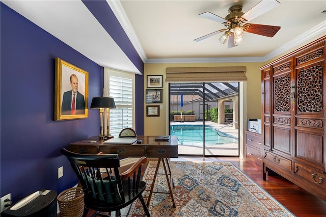 office space featuring wood-type flooring, ornamental molding, and ceiling fan