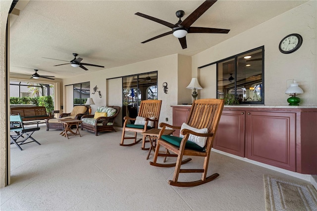 interior space featuring ceiling fan and an outdoor hangout area