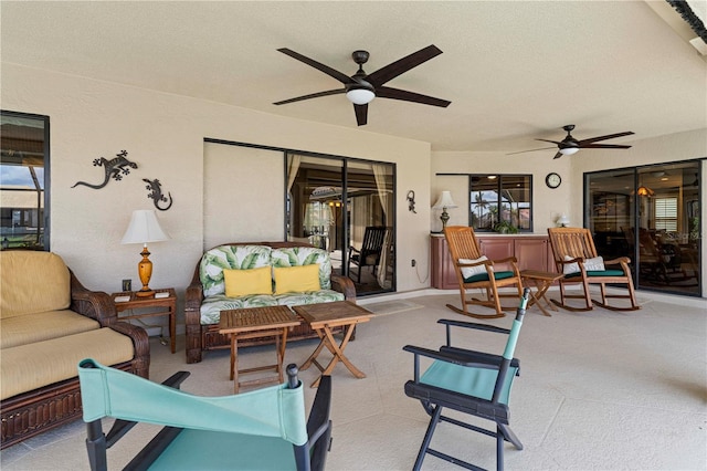 view of patio with outdoor lounge area and ceiling fan