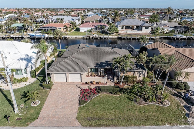 birds eye view of property with a water view