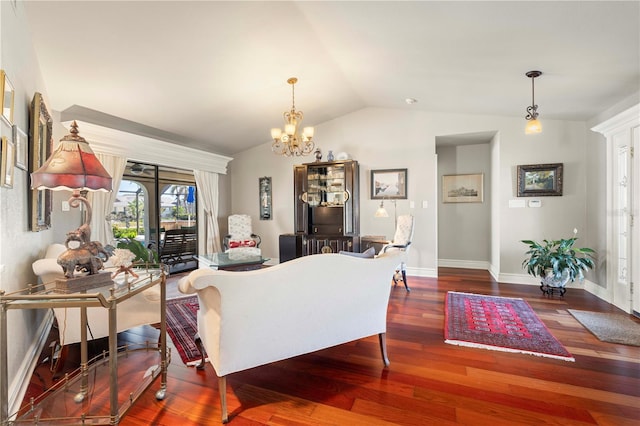 living room with lofted ceiling, dark hardwood / wood-style floors, and an inviting chandelier