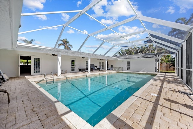 view of pool with a patio area, a lanai, and ceiling fan