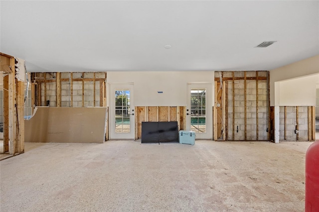 unfurnished living room with carpet flooring