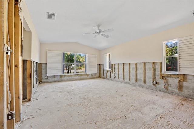 spare room featuring a wealth of natural light, vaulted ceiling, and ceiling fan