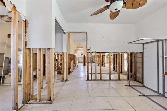 misc room featuring light tile patterned floors and ceiling fan